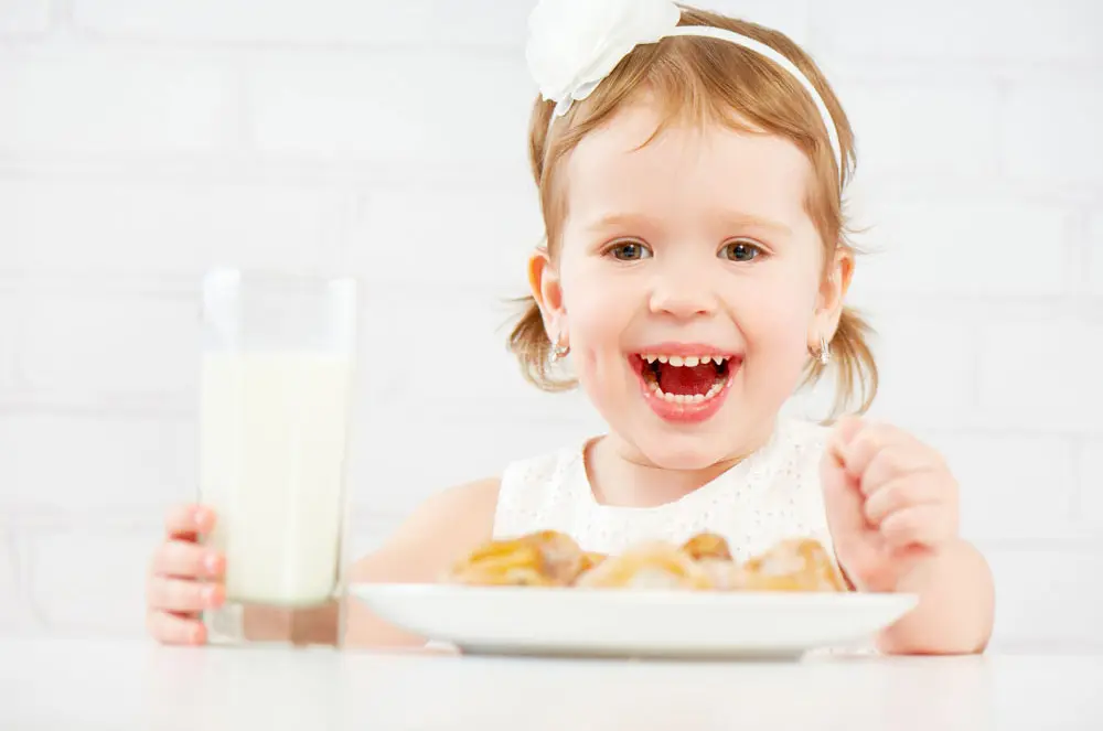 Young Girl Eating a Meal